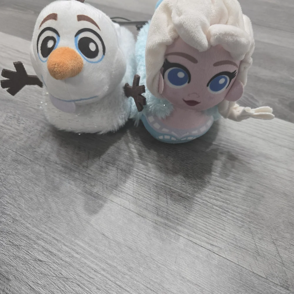 Disney Frozen toddler girls' sock top slippers feature mismatched Elsa and Olaf
